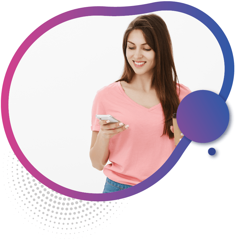 A person in a pink shirt holds a smartphone and a drink, symbolizing the convenience of using eSIM technology for seamless international travel connectivity in Australia
